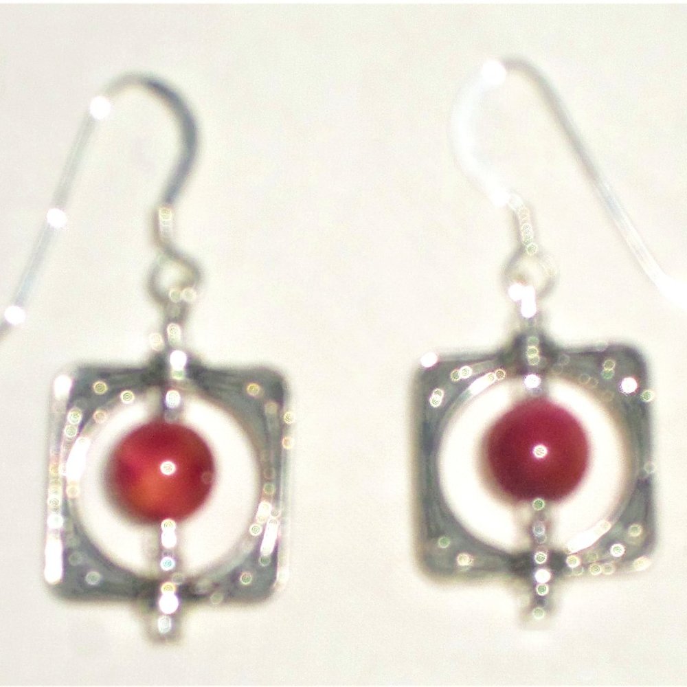 Silver-frame red spinners hook earrings